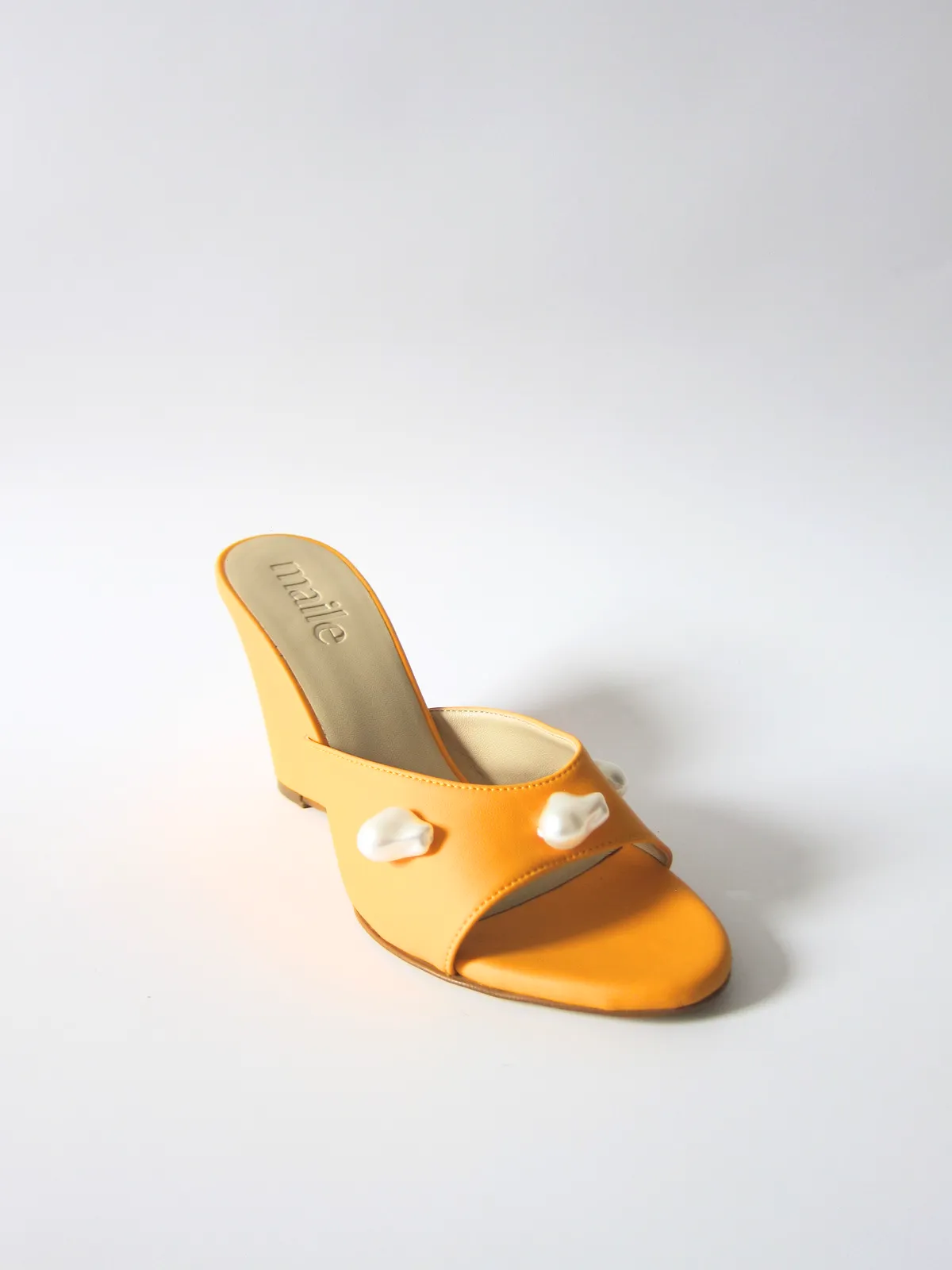 kourtney mango orange wedge