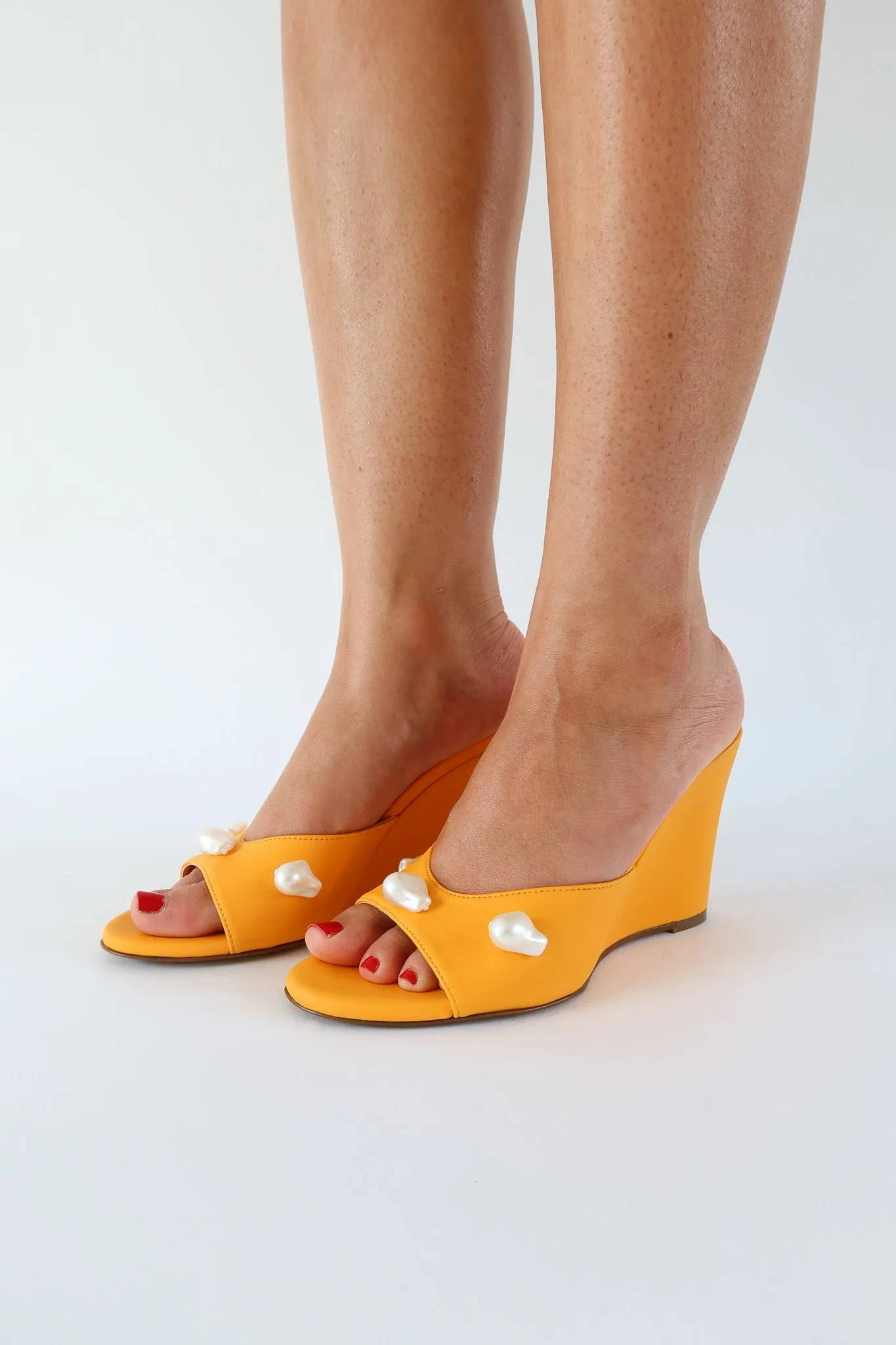 kourtney mango orange wedge